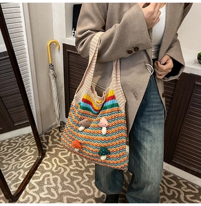 Detailed close-up of handmade rainbow crochet tote bag with 3D mushroom patches decoration