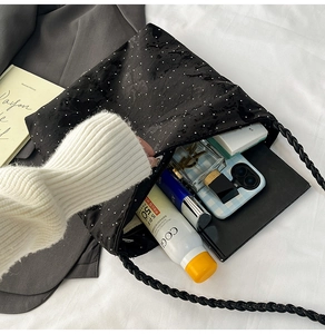Detailed interior of a black polka dot tote bag showing large capacity for essentials