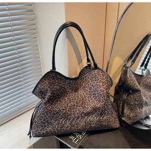 Detail of leopard print tote bag with embroidery on a soft canvas structure