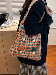 Rainbow striped crochet shoulder bag with 3D mushroom patches and wave pattern knit