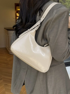 Fashionable beige cream patent leather baguette bag for women with adjustable shoulder strap