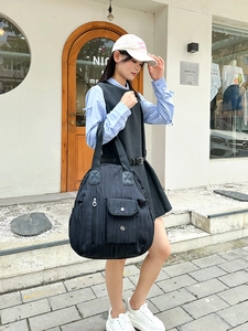 Black quilted nylon tote bag with large capacity for travel and daily casual style