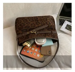 Detailed view of leopard print tote bag interior showing large capacity for essentials