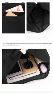 Detail view of black waterproof tote bag showing multi-compartment interior storage