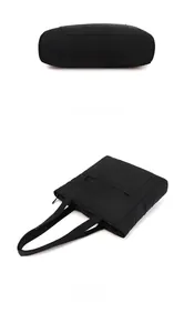 Detail view of the waterproof black nylon tote bag showing bottom and flat layout