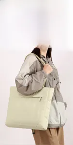 Waterproof light green nylon tote bag with multiple compartments for daily commuting