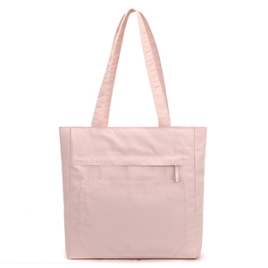 Front view of light pink waterproof tote bag with zipper pocket and dual shoulder straps