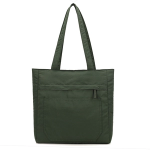 Detail showing deep olive green nylon fabric texture and stitching of the tote bag