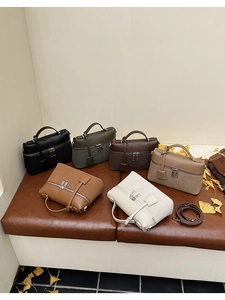 Detail view of multi-color crossbody bags in leather and suede with double zipper design