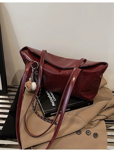 Deep burgundy glossy leather shoulder tote bag with vintage finish and baseball charms