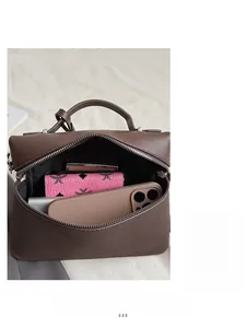 Interior view of large capacity dark brown leather handbag showing spacious storage