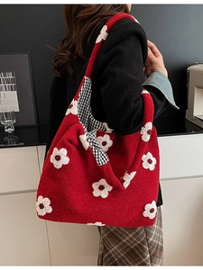 Red plush tote bag with white flower pattern and checkered lining for winter
