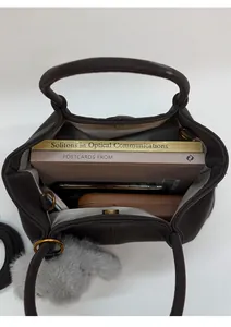 Top view of spacious brown suede tote bag showing interior storage for books and phone