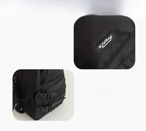 Close-up of black messenger bag with side buckle straps and woven fashion brand label