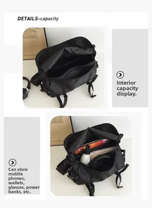 Detailed interior of a black large capacity messenger bag showing compartments and pockets