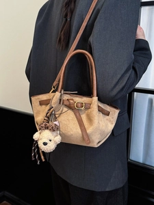 Women's warm camel suede tote bag with leopard bear charm and fine belt buckle detail