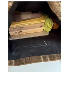 Top view of spacious vintage plaid tote bag interior with multiple daily items