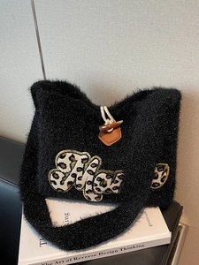 Retro black knit shoulder bag with leopard patch and wooden toggle closure for winter