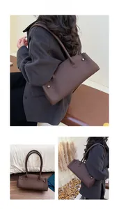 Detailed views of dark brown leather baguette bag with dual handles and silver hardware