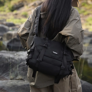 Detail of waterproof nylon messenger bag with adjustable buckles and functional straps