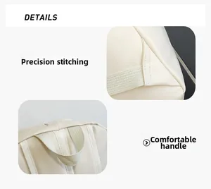 Detail of high-quality stitching and comfortable handle on a beige leather backpack