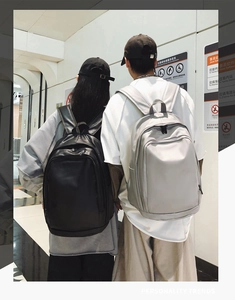 Rear view of minimalist waterproof large capacity backpacks in black and beige colors