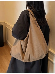 Minimalist khaki large capacity tote bag with wide strap for casual shoulder wear