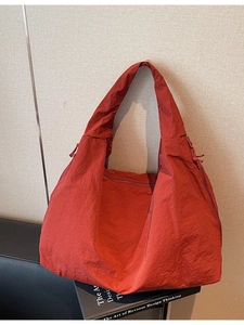 Large capacity red tote bag with crinkle texture nylon fabric and wide shoulder strap