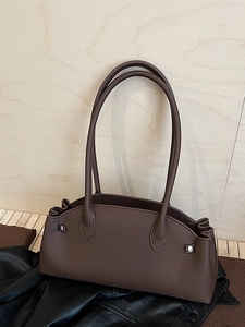 Dark brown lychee grain leather baguette bag with wavy top and long slim shoulder straps