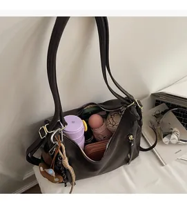 Deep brown large capacity faux leather tote bag showing spacious storage for daily items