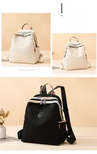 Detail of waterproof nylon backpack with ethnic patterned straps and logo patch