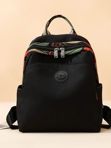 Women's large black Oxford backpack with vibrant floral embroidery and top handle