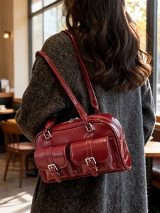 Retro wine red Boston bag with shiny leather and front buckle pockets for women