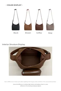 Internal view of minimalist bucket bag showing magnetic closure and zipped pouch