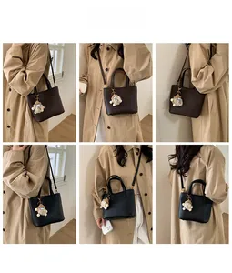 Detailed views of leather bucket bag shown from six different wearing angles with a charm