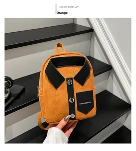 Detail of orange suede mini backpack featuring shirt-collar design and metal buttons