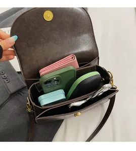 Interior view of brown flap crossbody bag showing spacious capacity for daily essentials
