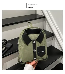 Detail of green shirt-style mini backpack with collar and silver buttons on steps