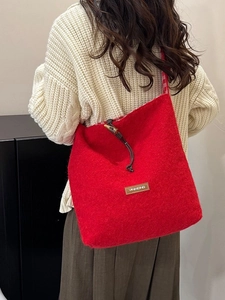 Winter red wool tote bag with toggle closure and vintage leather label for women