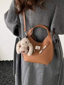 Vintage caramel brown leather hobo bag with silver buckle and cute bunny charm accessory