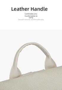 Detail of comfortable beige leather handle on a textured fabric backpack for women