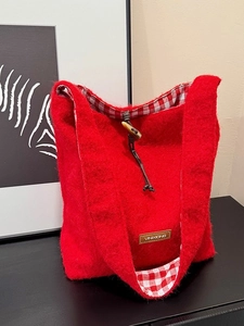 Winter wool felt tote bag in red with classic toggle closure and plaid lining details