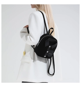 Creative black shirt-style backpack with collar and button detail on white background