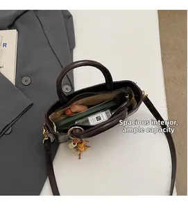 Interior view of brown faux crocodile leather handbag showing spacious storage capacity