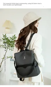 Detail of durable black textured PU leather backpack with metallic rabbit logo on side view