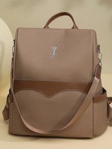 Minimalist large capacity dark brown backpack with metallic rabbit logo and anti-theft design