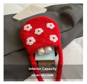 Interior view showing the large capacity of the plush flower embroidered bucket bag