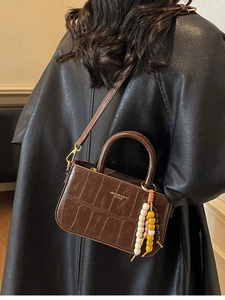 Vintage brown crocodile embossed handbag with colorful bead tassel and gold lettering