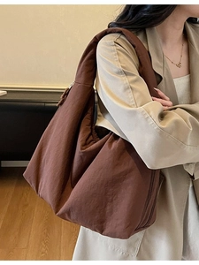 Brown quilted oversized tote bag for women featuring a minimalist aesthetic for daily commute