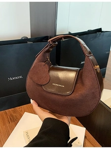 Retro dark brown suede and leather half-moon shoulder bag with a heart charm detail